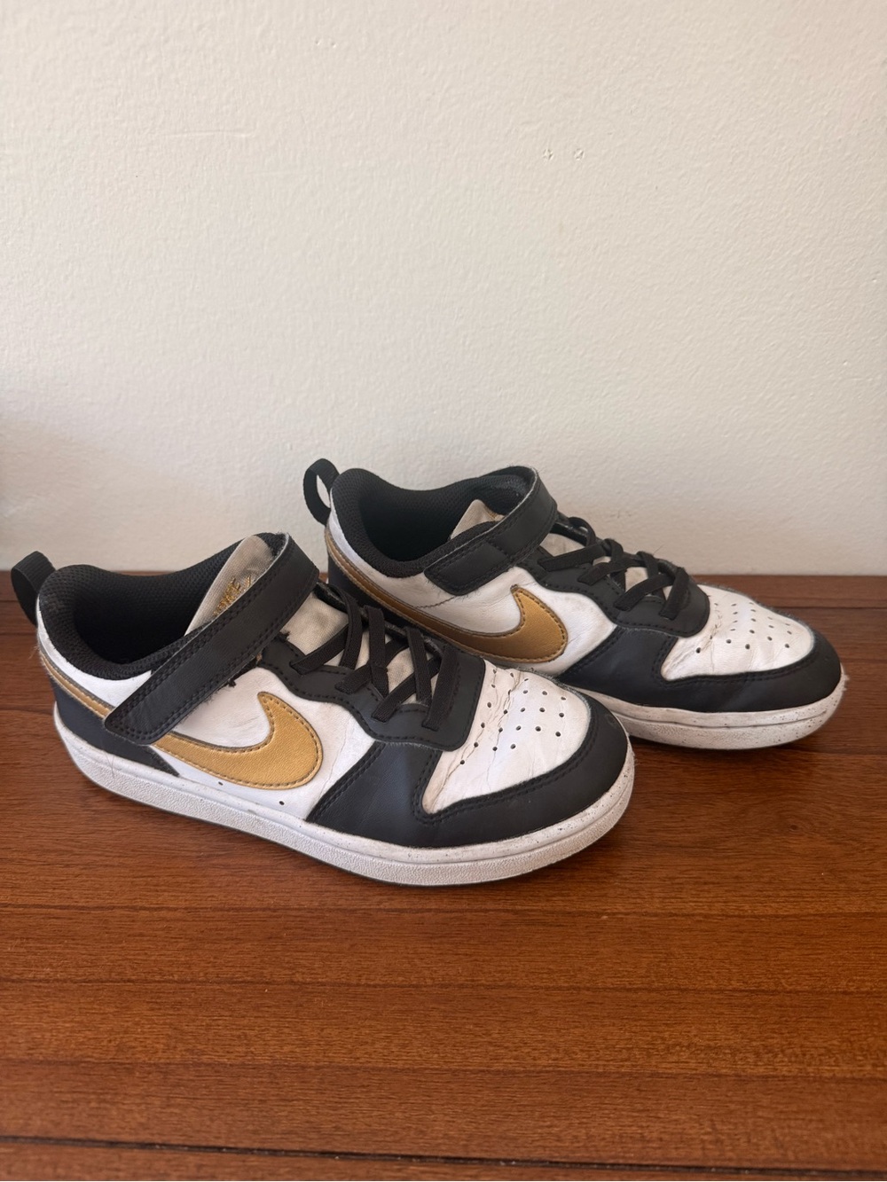 Nike Kids Court Borough Low-Top Sneakers in White, Black & Gold Swoosh